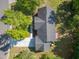 An aerial view of the house shows the roof, backyard deck, driveway, front yard, and surrounding greenery at 1998 Ferbow St, Creedmoor, NC 27522