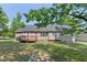 A large backyard with a wood deck, providing an ideal space for outdoor entertaining and leisure at 1998 Ferbow St, Creedmoor, NC 27522