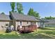 Backyard showcasing the deck with room for outdoor dining and entertaining at 1998 Ferbow St, Creedmoor, NC 27522