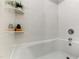 Clean and modern bathtub area featuring white tile at 1998 Ferbow St, Creedmoor, NC 27522