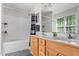 Bathroom featuring vanity, mirror, and shower with tub at 1998 Ferbow St, Creedmoor, NC 27522