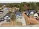 Aerial view of charming light blue home with well-manicured lawn and ample parking space at 2015 Cheek Rd, Durham, NC 27704