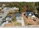 Aerial view of a charming light blue home with well-manicured lawn and ample parking space at 2015 Cheek Rd, Durham, NC 27704