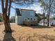 Exterior angle showcasing the backyard deck of this two-story home at 2015 Cheek Rd, Durham, NC 27704
