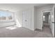 Bedroom features soft carpet, light walls, and a window seat next to double doors at 2015 Cheek Rd, Durham, NC 27704