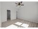 Spacious bedroom with neutral walls, a ceiling fan, and ample closet space at 2015 Cheek Rd, Durham, NC 27704