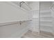 Well-organized walk-in closet with custom shelving and ample storage space at 2015 Cheek Rd, Durham, NC 27704