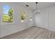 Bright living room with natural light, modern light fixtures, and views of nature at 2015 Cheek Rd, Durham, NC 27704