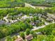 Aerial view of the community with lush green surroundings and well-maintained homes at 208 Bellagio Dr, Apex, NC 27539