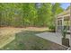 Large backyard featuring a well-maintained lawn and a cozy patio area at 208 Bellagio Dr, Apex, NC 27539