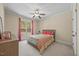 Bedroom with neutral carpet, neutral colored walls, and a window looking out at the trees at 208 Bellagio Dr, Apex, NC 27539