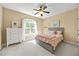 Inviting bedroom with neutral décor and plenty of natural light at 208 Bellagio Dr, Apex, NC 27539
