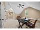 Bright bonus room with sloped ceilings, neutral carpet, and office space at 208 Bellagio Dr, Apex, NC 27539