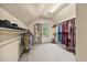 Organized walk-in closet with shelving and hanging racks at 208 Bellagio Dr, Apex, NC 27539