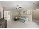 Bright living room featuring neutral tones and a cozy sectional sofa at 208 Bellagio Dr, Apex, NC 27539