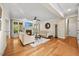 Comfortable living space with a fireplace, inviting sofas, and access to the backyard at 208 Bellagio Dr, Apex, NC 27539