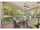 Relaxing screened porch with comfortable seating and a view of the lush backyard at 208 Bellagio Dr, Apex, NC 27539
