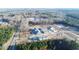 Wide aerial view of a new townhome construction and adjacent wooded areas at 2109 Glen Crossing Dr, Durham, NC 27704