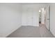 Light-filled bedroom with a window, a door leading to bathroom and neutral-colored carpet at 2109 Glen Crossing Dr, Durham, NC 27704