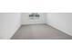Bedroom features neutral carpet and natural light from a window at 2109 Glen Crossing Dr, Durham, NC 27704