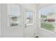 Bright entryway featuring natural light from windows with blinds and a white door at 2109 Glen Crossing Dr, Durham, NC 27704
