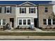 Modern townhome exterior with brick and siding accents, enhanced by a well-kept lawn at 2109 Glen Crossing Dr, Durham, NC 27704