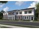 Charming townhome exterior showcasing a blend of textures and colors with well-manicured landscaping at 2109 Glen Crossing Dr, Durham, NC 27704