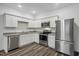 Modern kitchen features stainless appliances, granite countertops, and wood-look floors at 2109 Glen Crossing Dr, Durham, NC 27704
