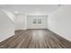 Spacious living room with wood-look floors, recessed lighting, and natural light at 2109 Glen Crossing Dr, Durham, NC 27704