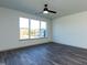 Spacious bedroom with a ceiling fan and large window offering a view of the outdoors at 2205 Gathering Square Ct, Fuquay Varina, NC 27526