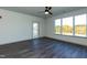 Bright bedroom with a ceiling fan and large window with outdoor view at 2205 Gathering Square Ct, Fuquay Varina, NC 27526