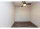 Empty bedroom with neutral paint, modern ceiling fan, and sleek hard surface flooring at 2205 Gathering Square Ct, Fuquay Varina, NC 27526