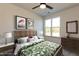 Staged bedroom with a ceiling fan and a bed, and artwork at 2205 Gathering Square Ct, Fuquay Varina, NC 27526
