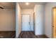 Welcoming entryway with a white front door and neutral interior paint, offering a clean aesthetic at 2205 Gathering Square Ct, Fuquay Varina, NC 27526