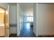 Hallway view looking into the kitchen with matching countertops and stainless steel appliances at 2205 Gathering Square Ct, Fuquay Varina, NC 27526