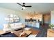 Open-concept living room and kitchen with modern finishes and comfortable seating arrangement at 2205 Gathering Square Ct, Fuquay Varina, NC 27526