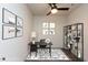 Home office featuring modern furnishings, contemporary artwork, and a stylish bookshelf at 2205 Gathering Square Ct, Fuquay Varina, NC 27526