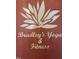 A signage for a Yoga Studio with a lotus logo at 2205 Gathering Square Ct, Fuquay Varina, NC 27526