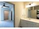Bathroom featuring tiled walk-in shower, vanity, and laundry at 2316 Gathering Square Ct, Fuquay Varina, NC 27526