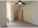 Bedroom featuring neutral tones, carpet, a ceiling fan, and walk-in closet at 2316 Gathering Square Ct, Fuquay Varina, NC 27526