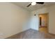 Bright bedroom with neutral carpet, a ceiling fan, and an en-suite bathroom at 2316 Gathering Square Ct, Fuquay Varina, NC 27526