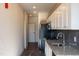 Modern kitchen with stainless steel appliances, gray subway tile, and neutral finishes at 2316 Gathering Square Ct, Fuquay Varina, NC 27526