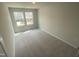 Bright, carpeted bedroom showcases natural light from windows, neutral paint, and spacious design at 247 Paramount Dr # 104, Smithfield, NC 27577