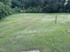 Large flat backyard with some trees at 284 Irvan St, Clayton, NC 27520