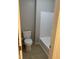 Bathroom featuring a white toilet, tile floor, and a shower over tub combo with white surround at 284 Irvan St, Clayton, NC 27520