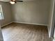 Bedroom features modern paint, wood-look flooring, and a ceiling fan at 284 Irvan St, Clayton, NC 27520