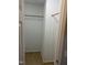 A closet with a clothes rod and neutral tile flooring, ready for organizing your wardrobe at 284 Irvan St, Clayton, NC 27520