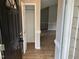Inviting foyer with wood-look flooring and a coat closet upon entry into the home at 284 Irvan St, Clayton, NC 27520