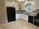 Bright kitchen features white cabinets, granite countertops, and stainless steel sink at 284 Irvan St, Clayton, NC 27520