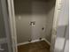 Laundry room equipped with hookups, ready for a washer and dryer, with durable wood-look flooring at 284 Irvan St, Clayton, NC 27520